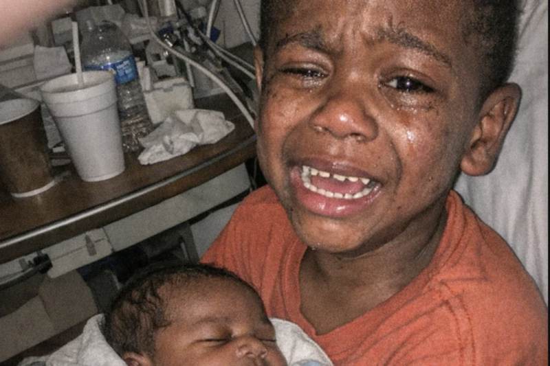The stillborn baby was placed in his older brother’s arms, seconds later, a cry echoes loudly!