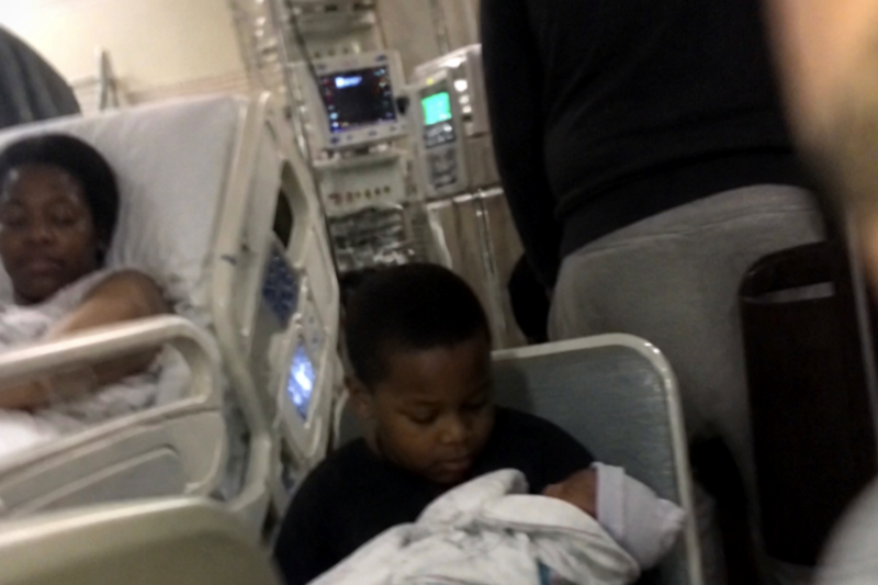 The stillborn baby was placed in his older brother’s arms, seconds later, a cry echoes loudly!